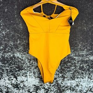 Gold swimsuit size 10 new with tags, cheeky bottom,low back with straps to tie